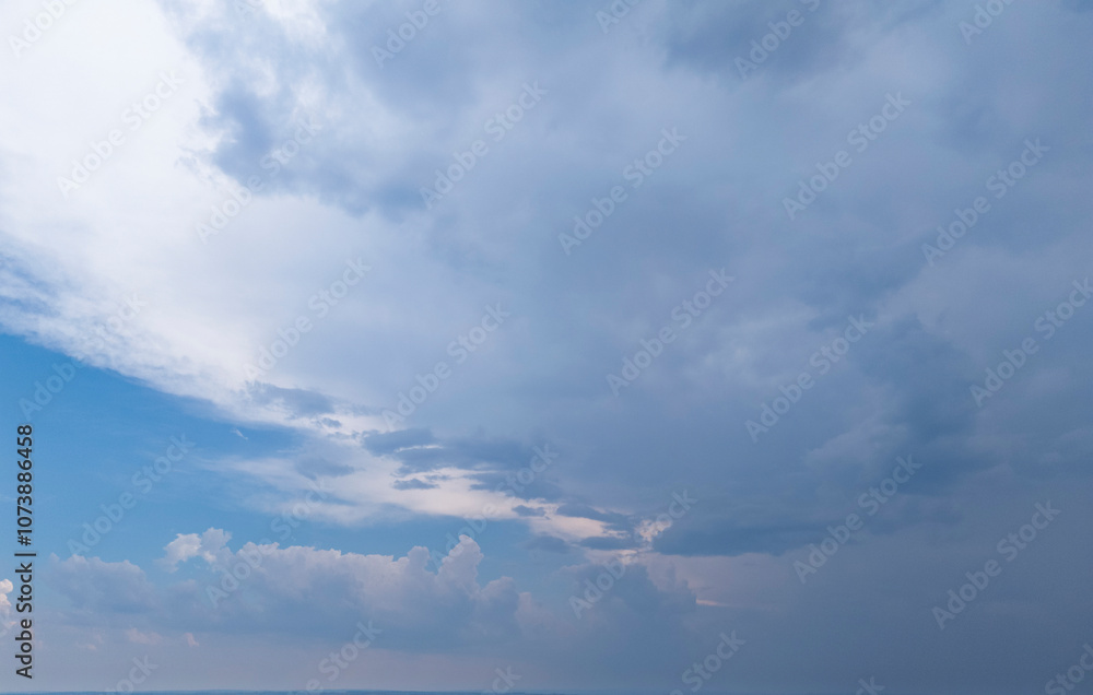 A stunning view of cloudy skies transitioning from blue to gray, capturing nature's mood. Perfect for backgrounds or weather themes. A stunning view of cloudy skies transitioning from blue to gray, capturing nature's mood. Perfect for backgrounds or weather themes.