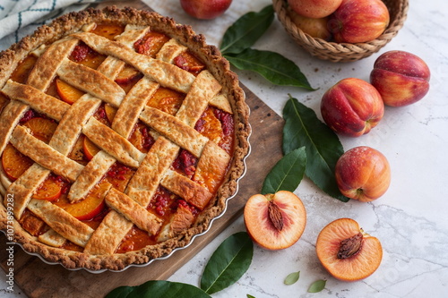 Homemade peach pie with lattice crust - ideal for food blogs, recipe websites, baking tutorials, or summer dessert inspiration
