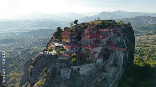  the stunning monasteries atop towering cliffs in Meteora, Greece during sunset