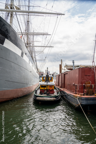 Tugboat between two boats in NYC  photo