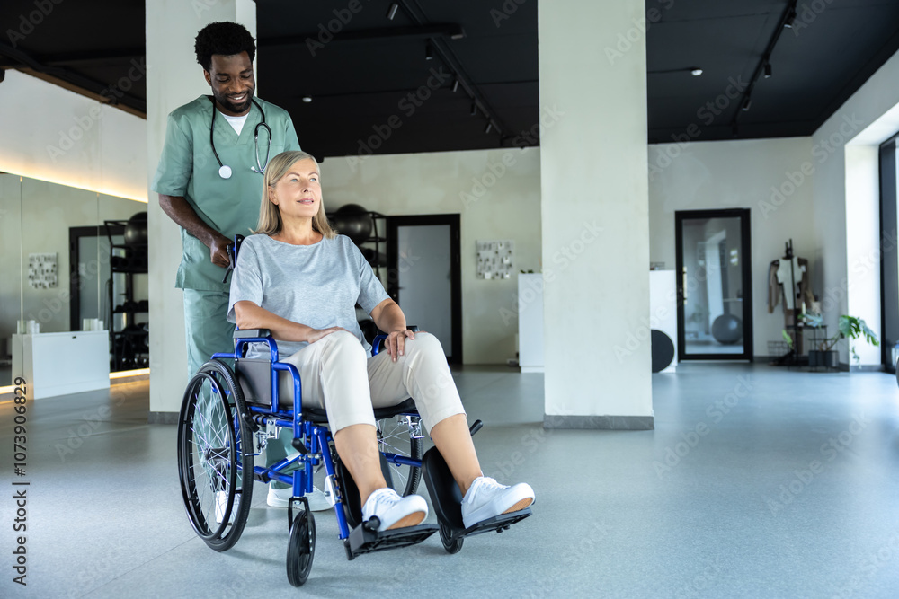 African american doctor carrying a wheel-chair with a female patient African american doctor carrying a wheel-chair with a female patient