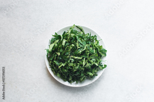 Top view of sliced pumpkin leaves, nigerian ugwu leaves sliced for cooking, sliced fluted pumpkin leaves photo