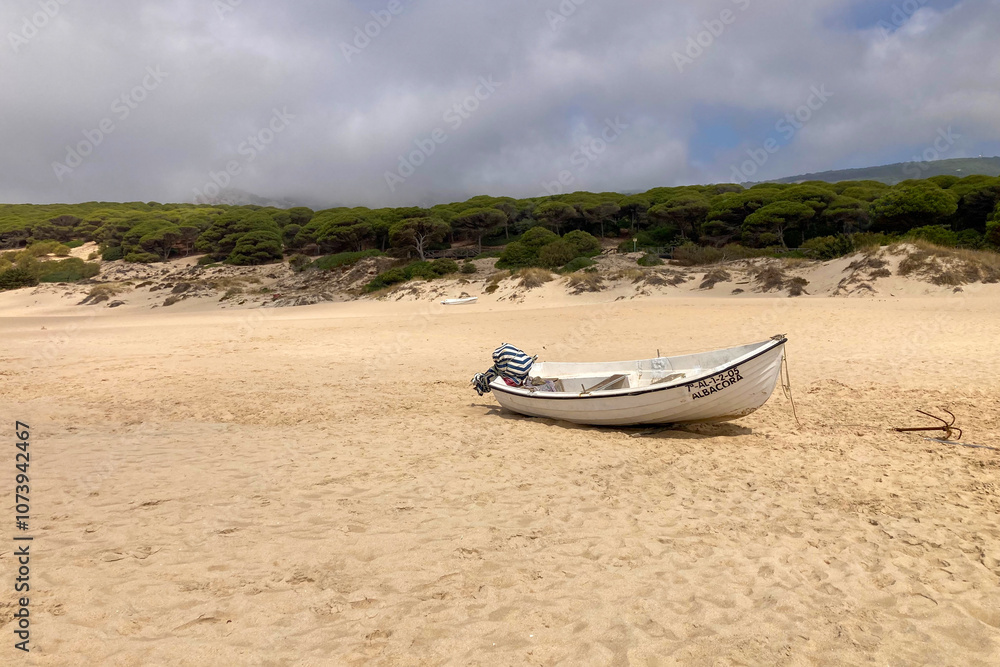 Boat on Bolonia beach at Atlantic ocean coast in Tarifa, Spain Boat on Bolonia beach at Atlantic ocean coast in Tarifa, Spain
