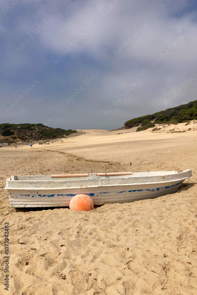 Boat on Bolonia beach at Atlantic ocean coast in Tarifa, Spain Boat on Bolonia beach at Atlantic ocean coast in Tarifa, Spain