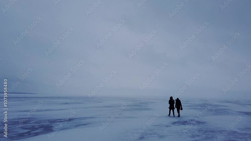 Drone Following Dancers on a Frozen Lake in Snowstorm Drone Following Dancers on a Frozen Lake in Snowstorm