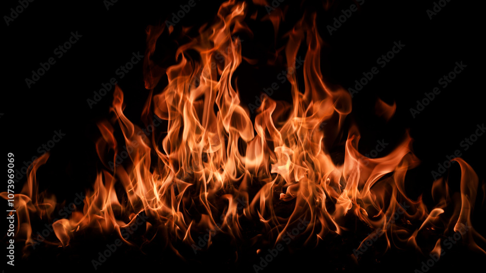 Fototapeta premium Fire background. Abstract dark background. Fire flame background. Abstract fire flame background. Large burning fire.