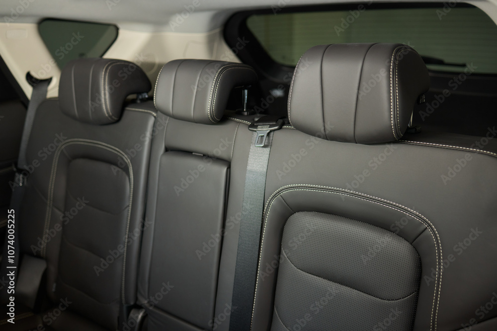 Obraz premium Car back seat with headrest and arm rest, a comfortable automotive fixture