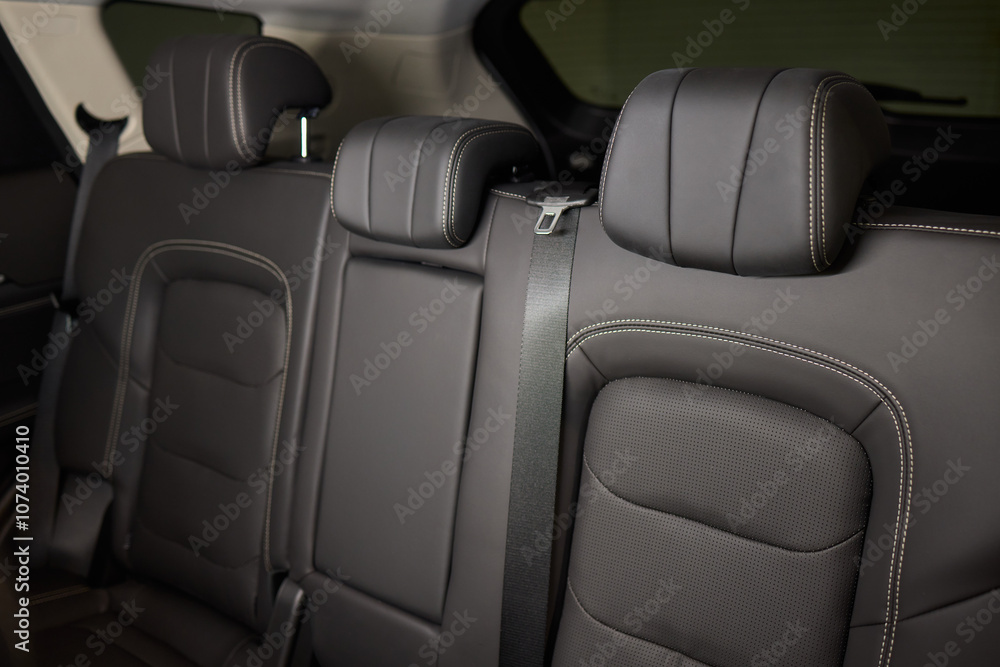 Obraz premium Car back seat with headrest and arm rest, a comfortable automotive fixture