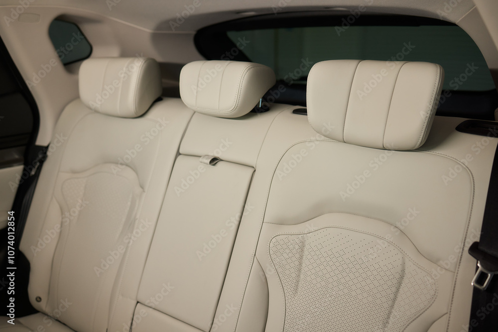 Obraz premium Car back seat with headrest and arm rest, a comfortable automotive fixture