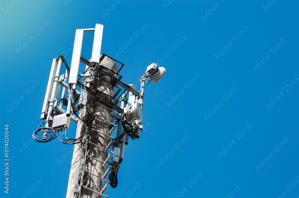 Close-up of 4G and 5G cell tower against the sky Close-up of 4G and 5G cell tower against the sky