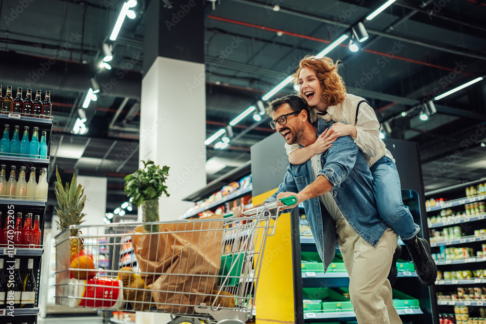 Happy couple having fun while shopping in supermarket Happy couple having fun while shopping in supermarket