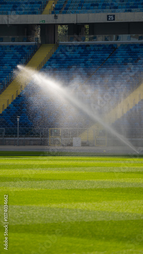 Obraz na płótnie sprinkler | watering the grass on the football pitch - special grass for playing football w salonie