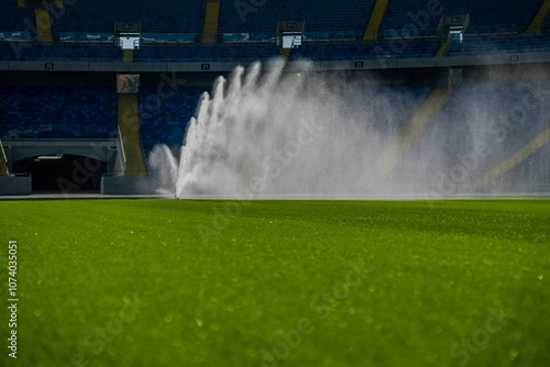 Obraz na płótnie sprinkler | watering the grass on the football pitch - special grass for playing football w salonie