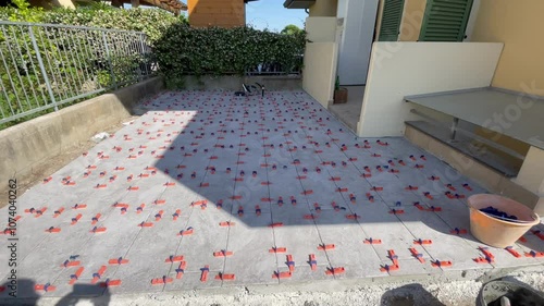 Outdoor patio tile installation, transforming your backyard with stylish and functional flooring photo