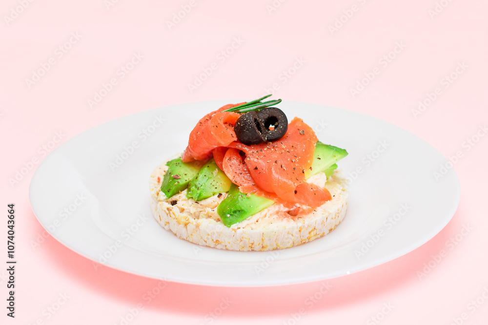 Rice Cake Sandwich with Fresh Salmon, Avocado and Olives on White Plate. Easy Breakfast. Diet Food. Quick and Healthy Sandwiches. Crispbread with Tasty Filling. Healthy Dietary Snack Rice Cake Sandwich with Fresh Salmon, Avocado and Olives on White Plate. Easy Breakfast. Diet Food. Quick and Healthy Sandwiches. Crispbread with Tasty Filling. Healthy Dietary Snack