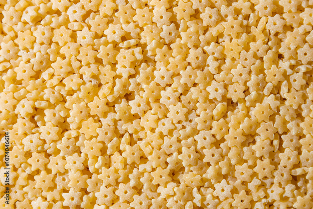 Uncooked Stelline Pasta: A Culinary Canvas of Stelline Macaroni, Creating a Lively and Textured Background for Gourmet Cooking. Dry Pasta. Raw Macaroni - Top View, Flat Lay Uncooked Stelline Pasta: A Culinary Canvas of Stelline Macaroni, Creating a Lively and Textured Background for Gourmet Cooking. Dry Pasta. Raw Macaroni - Top View, Flat Lay