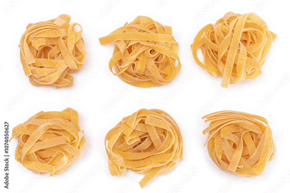 Six Classic Italian Raw Egg Fettuccine - Isolated on White Background. Dry Twisted Uncooked Pasta. Italian Culture and Cuisine. Raw Golden Macaroni Pattern - Isolation Six Classic Italian Raw Egg Fettuccine - Isolated on White Background. Dry Twisted Uncooked Pasta. Italian Culture and Cuisine. Raw Golden Macaroni Pattern - Isolation