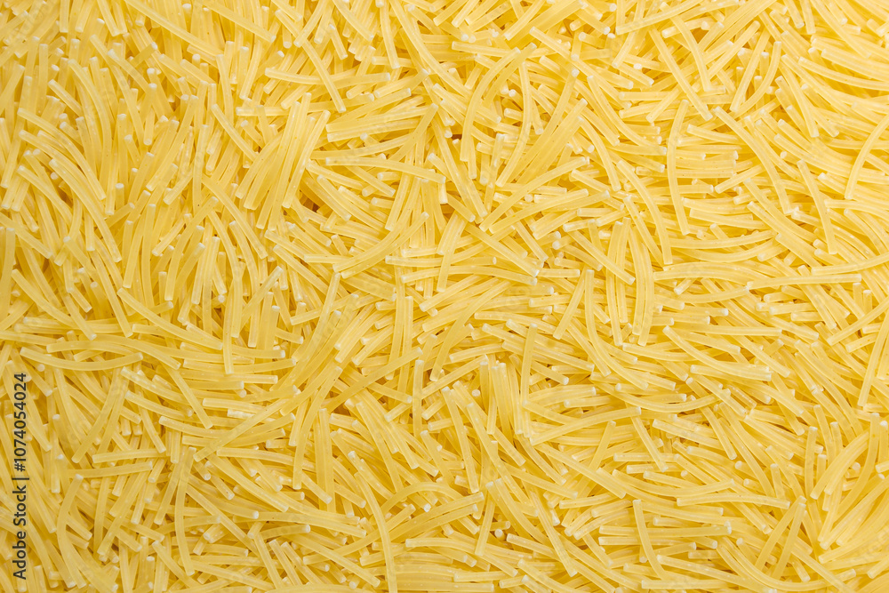 Uncooked Filini Pasta: A Culinary Canvas of Noodles, Creating a Lively and Textured Background for Gourmet Cooking. Dry Pasta. Raw Macaroni - Top View, Flat Lay Uncooked Filini Pasta: A Culinary Canvas of Noodles, Creating a Lively and Textured Background for Gourmet Cooking. Dry Pasta. Raw Macaroni - Top View, Flat Lay