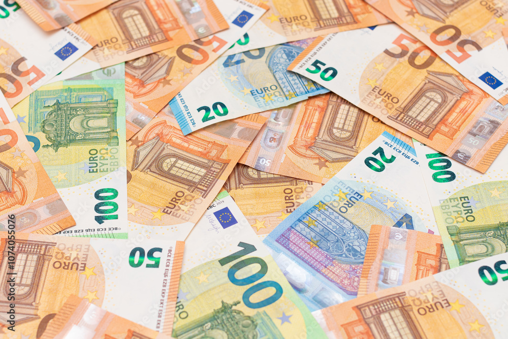 Different Euro Banknotes Money Background. Euro Money Currency. Colored Paper Money. A Lot of Fifty Euro Bills. Business, Finances, Cash and Money Saving Concept Different Euro Banknotes Money Background. Euro Money Currency. Colored Paper Money. A Lot of Fifty Euro Bills. Business, Finances, Cash and Money Saving Concept
