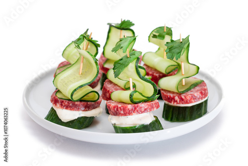 Canapes without Bread with Salami, Cucumber, Greens and Cream Cheese on White Plate - Isolated on White. Easy Breakfast. Diet Food. Quick and Healthy Sandwiches. Healthy Snacks with Tasty Fillings