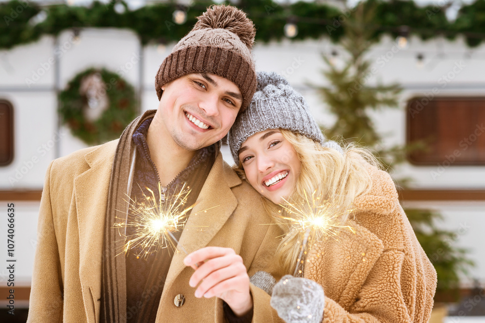 This cozy winter moment features a smiling couple holding sparklers amid a snowy landscape. They are dressed warmly, enjoying each other's company and the festive atmosphere. This cozy winter moment features a smiling couple holding sparklers amid a snowy landscape. They are dressed warmly, enjoying each other's company and the festive atmosphere.