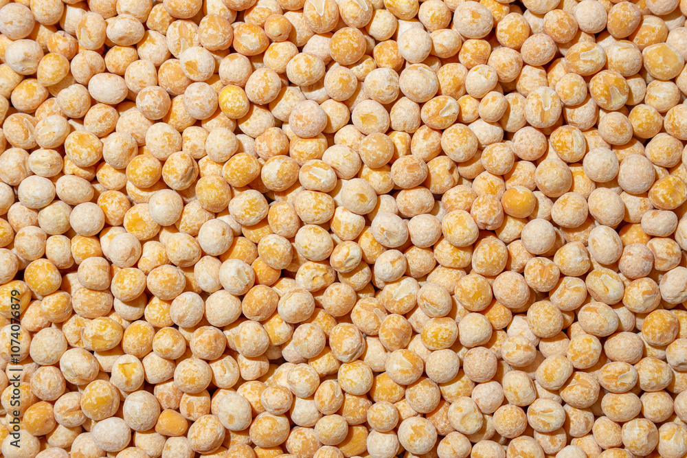 Uncooked Yellow Polished Peas Background. A Culinary Canvas of Dry Yellow Peas, Creating a Lively and Textured Background for Gourmet Cooking. Scattered Raw Polished Peas. Healthy Eating Ingredients Uncooked Yellow Polished Peas Background. A Culinary Canvas of Dry Yellow Peas, Creating a Lively and Textured Background for Gourmet Cooking. Scattered Raw Polished Peas. Healthy Eating Ingredients