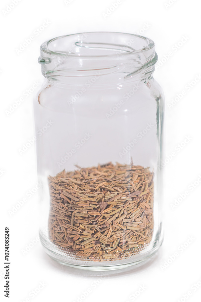 Rosemary Seasoning in a Small Glass Jar Isolated on White Background Rosemary Seasoning in a Small Glass Jar Isolated on White Background