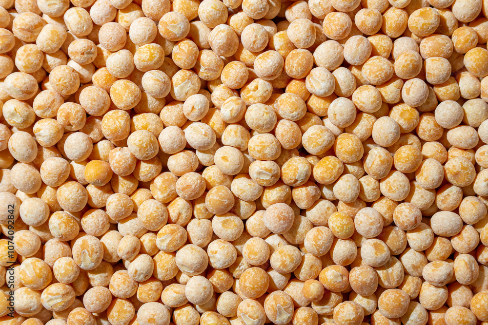 Uncooked Yellow Polished Peas Background. A Culinary Canvas of Dry Yellow Peas, Creating a Lively and Textured Background for Gourmet Cooking. Scattered Raw Polished Peas. Healthy Eating Ingredients Uncooked Yellow Polished Peas Background. A Culinary Canvas of Dry Yellow Peas, Creating a Lively and Textured Background for Gourmet Cooking. Scattered Raw Polished Peas. Healthy Eating Ingredients