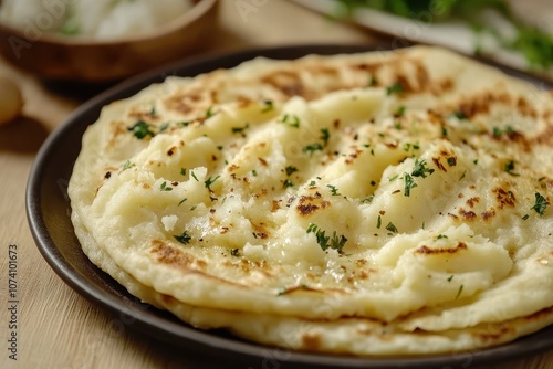 Kystyby a thin potato and onion filled flatbread served on a plate Web banner photo