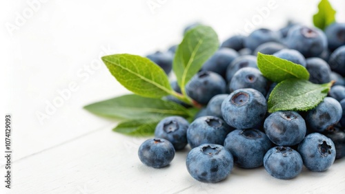 Close-up of fresh blueberries with green leaves , berries, healthy, food, organic, ripe, antioxidant, farm, agriculture