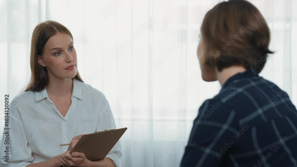 Happy patient and psychologist exchanging mental health conversation in clinic with positive emotion while explaining prim successful work and life to psychologist at psychologist clinic office Happy patient and psychologist exchanging mental health conversation in clinic with positive emotion while explaining prim successful work and life to psychologist at psychologist clinic office