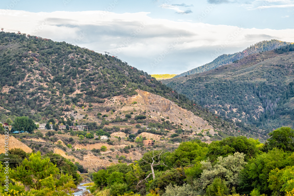Obraz premium Glenwood Springs, Colorado city mountain town with luxury houses homes by mountains nature landscape at sunset