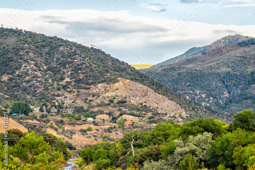 Glenwood Springs, Colorado city mountain town with luxury houses homes by mountains nature landscape at sunset