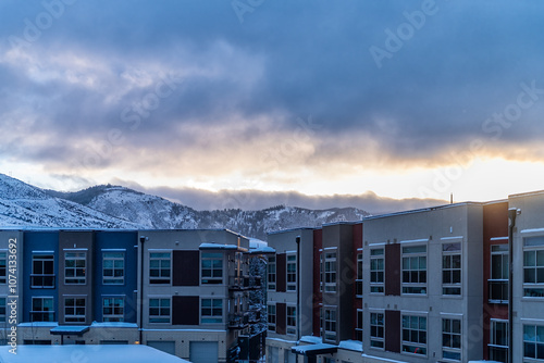 Avon, Colorado small town Mountain Village in winter snow view of Rocky Mountains and modern apartment architecture by Vail