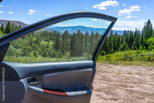 Castle Peak park in Colorado with coniferous trees and landscape view from passenger door in Eagle County photo