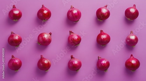 Vibrant red onions arranged neatly on a purple background, creating a striking visual contrast of colors