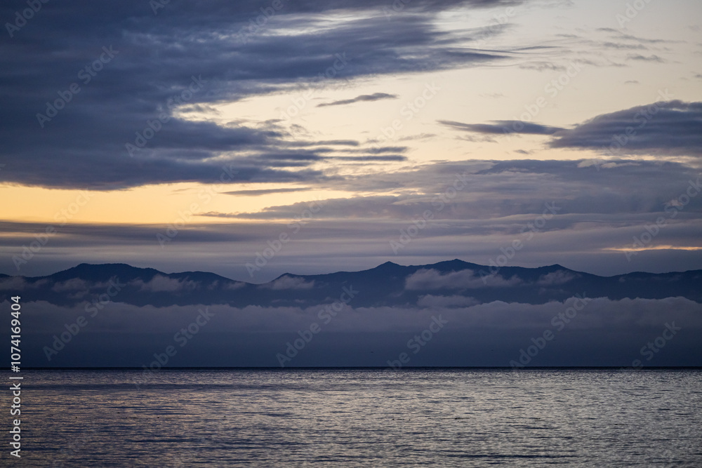 Serene Sunset Over Vancouver Island Mountains and Ocean Serene Sunset Over Vancouver Island Mountains and Ocean