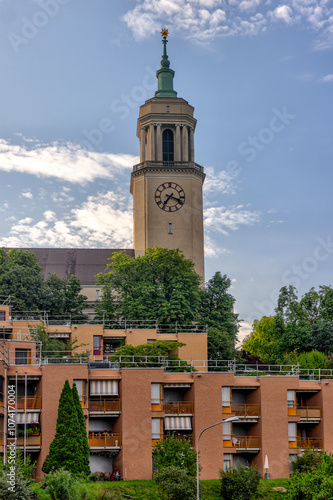 Zurich, Switzerland - July 26, 2024: The clock tower of Grosse Kirche Fluntern church in Zurich Switzerland
 photo