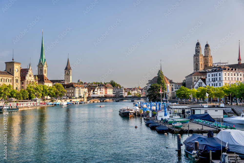 Zurich, Switzerland - July 26, 2024: The waterfront and old town at the mouth of the Limmat Riverl in Zurich Switzerland