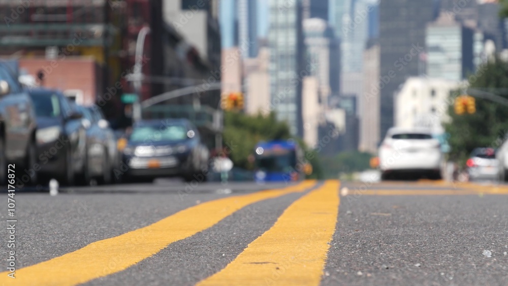 New York City skyline, Manhattan Midtown cityscape. High-rise skyscrapers from Queens, Long Island, Hunters Point, USA. Cars on street, yellow dividing line, road marking. United States architecture. New York City skyline, Manhattan Midtown cityscape. High-rise skyscrapers from Queens, Long Island, Hunters Point, USA. Cars on street, yellow dividing line, road marking. United States architecture.