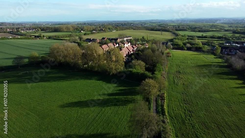 Ariel flight along country path leading to a small rural Yorkshire ex mining village estate. photo