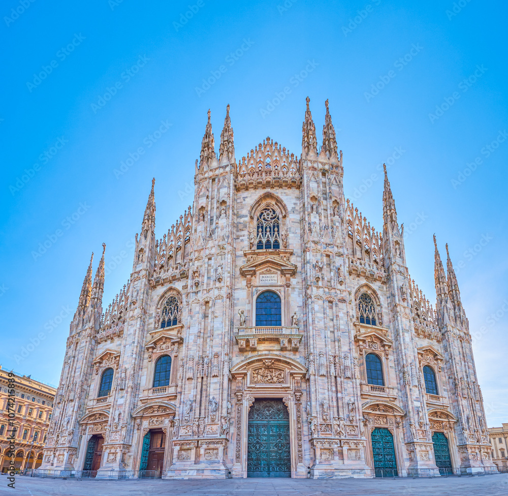 Fototapeta premium Marble facade of Milan Duomo, the main landmark of the city, Milan, Italy