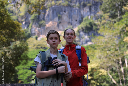 Wallpaper Mural Mother and son hiking in the autumn forest, enjoying nature and smiling together Torontodigital.ca