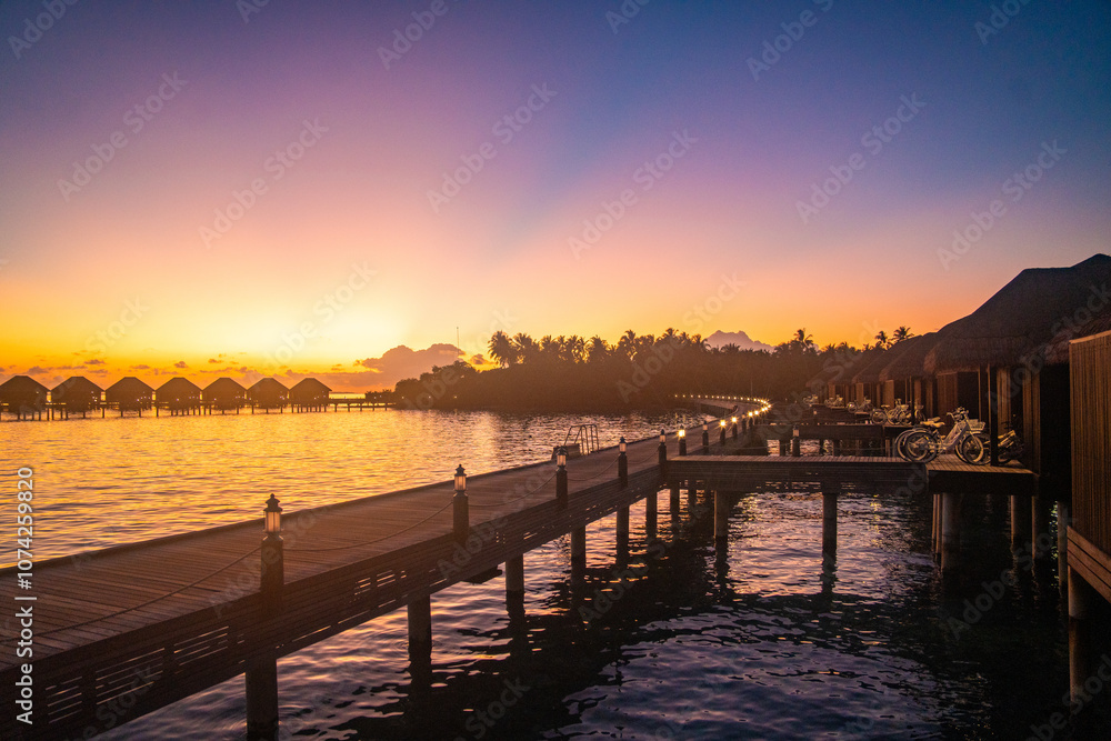 Sunset views from overwater pool villa in Maldives Sunset views from overwater pool villa in Maldives