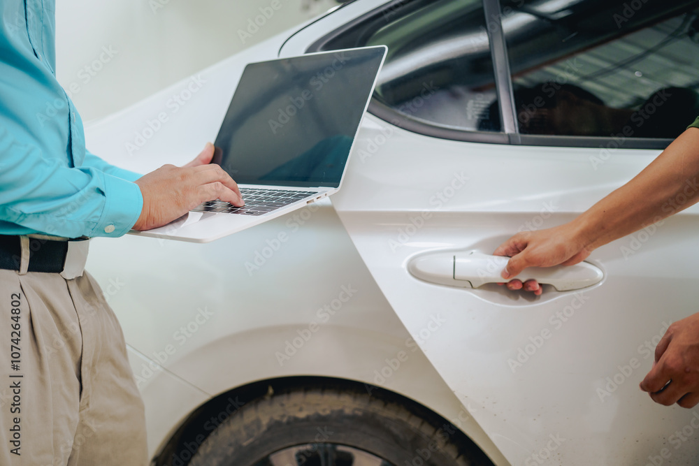 Asian clients engage with a car insurance agent beside a wrecked vehicle. They examine the policy details, assess the damage, and finalize paperwork related to the insurance claim and repairs. Asian clients engage with a car insurance agent beside a wrecked vehicle. They examine the policy details, assess the damage, and finalize paperwork related to the insurance claim and repairs.
