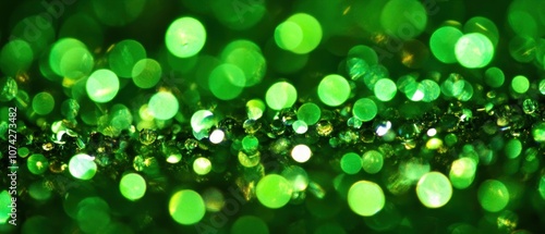 A close-up image of shimmering green bokeh, creating a vibrant and festive atmosphere.