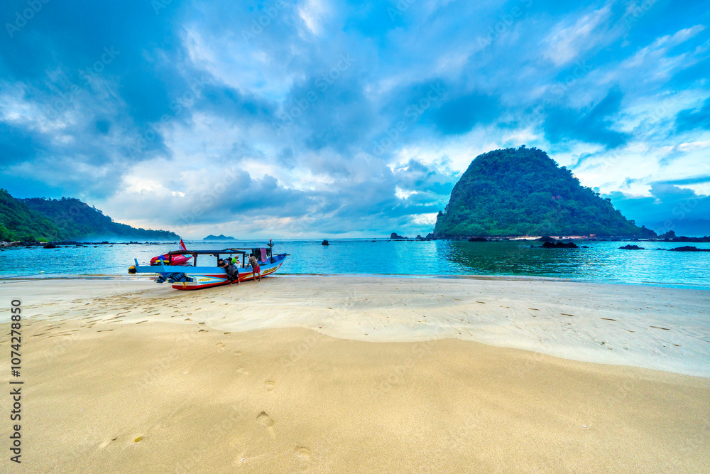 Fototapeta premium Beautiful tropical beach on Red Island (Pulau Merah) coast