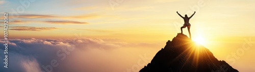 Person celebrating achievement on a mountain at sunrise.