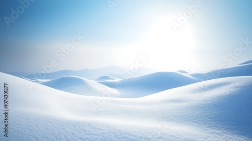 Snow-covered hills with a bright sky in the background