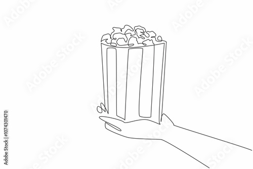 National Popcorn Day. One continuous line drawing of person hand holding stripped paper bucket contain salted popcorn. Food snack to watch a movie concept. Single line draw vector graphic illustration